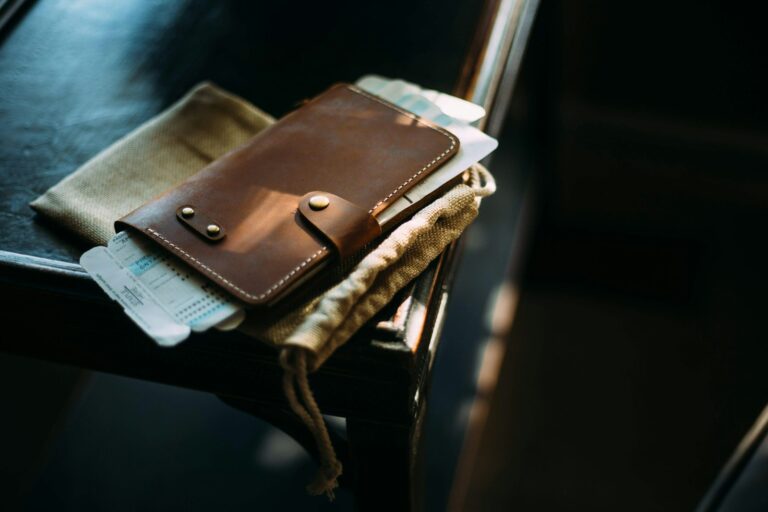 An open notebook and pen on a wooden table